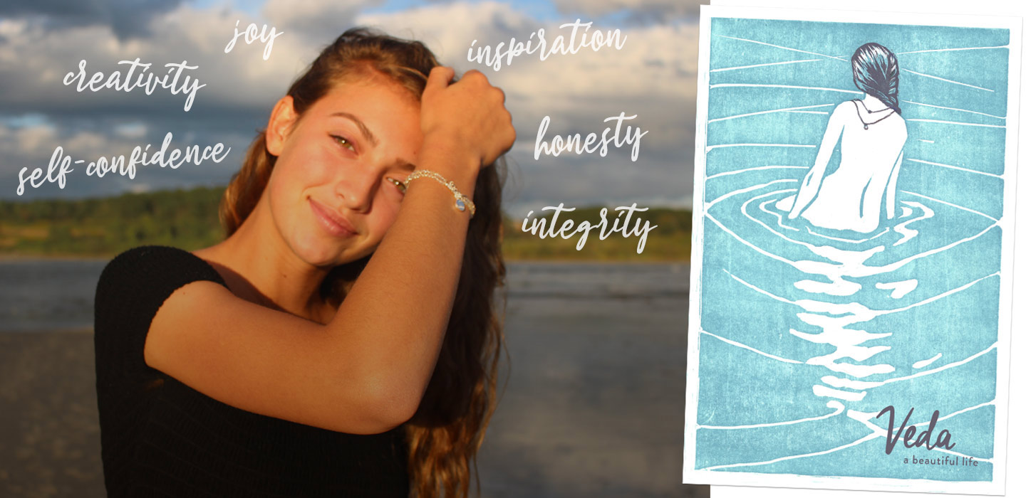 young girl wearing veda jewelry bracelet on the maine shore